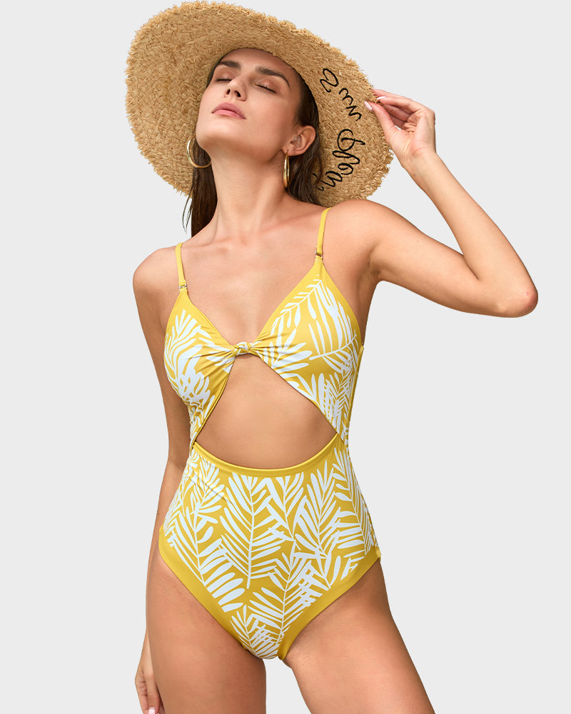 reversible swimsuit, one piece swimsuit, palm leaf swimsuit, cut out swimsuit, beach swimwear, chic one piece, poolside swimsuit, flattering swimwear, adjustable strap swimsuit, stylish swimsuit, reversible one piece swimwear, palm leaf print swimwear, trendy cut out design, elegant beachwear, adjustable chic swimwear, fashionable flattering poolside swimsuit, stylish reversible swimsuit